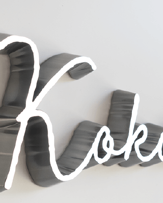 Kokochiという文字の切り文字の細いサイン